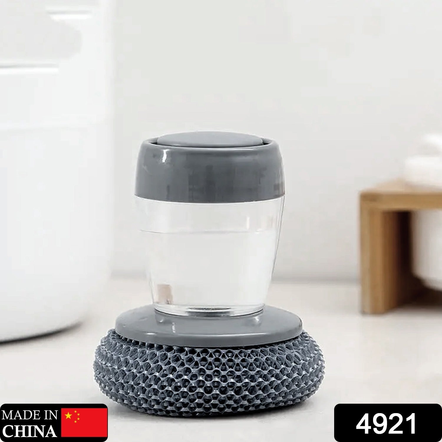 Close-up of a palm brush with soap dispenser, perfect for washing dishes Close-up of a palm brush with soap dispenser, perfect for washing dishes